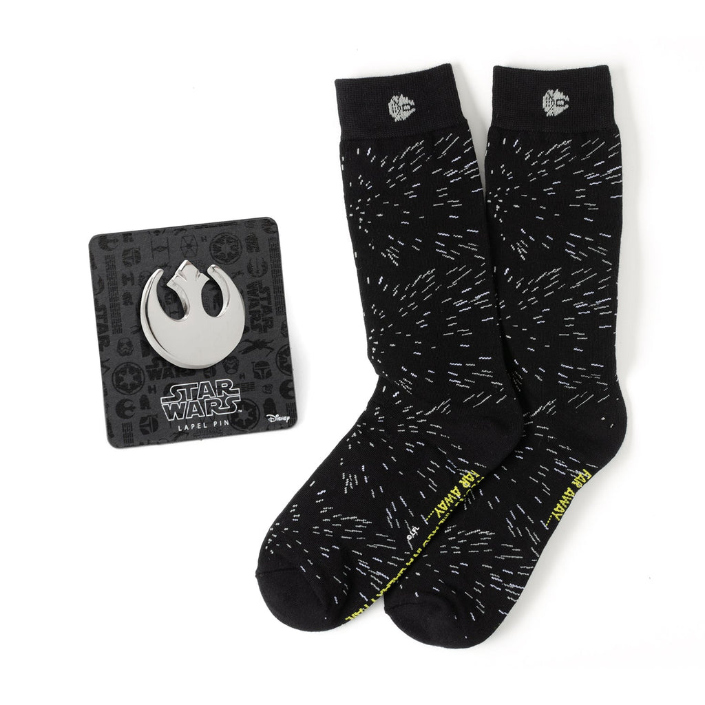 A gift set containing black crew socks with a white hyperspace pattern and a silver Rebel Alliance symbol lapel pin.