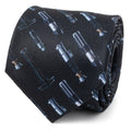 Close up of a black necktie featuring a repeating print of various Star Wars lightsaber hilts.