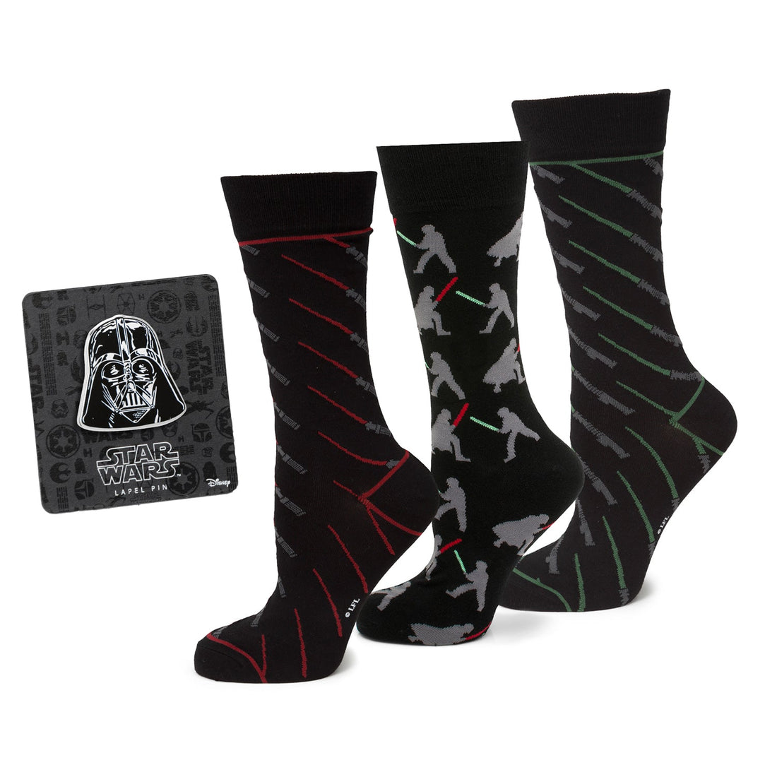Three pairs of Star Wars themed black crew socks and a Darth Vader lapel pin on a display card.