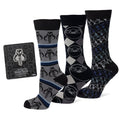 Three pairs of Star Wars Mandalorian dress socks including Mythosaur and Grogu designs next to a Mythosaur lapel pin.