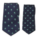 A navy blue men's tie with Mandalorian helmet patterns next to a matching smaller navy blue boys' tie with Grogu patterns.