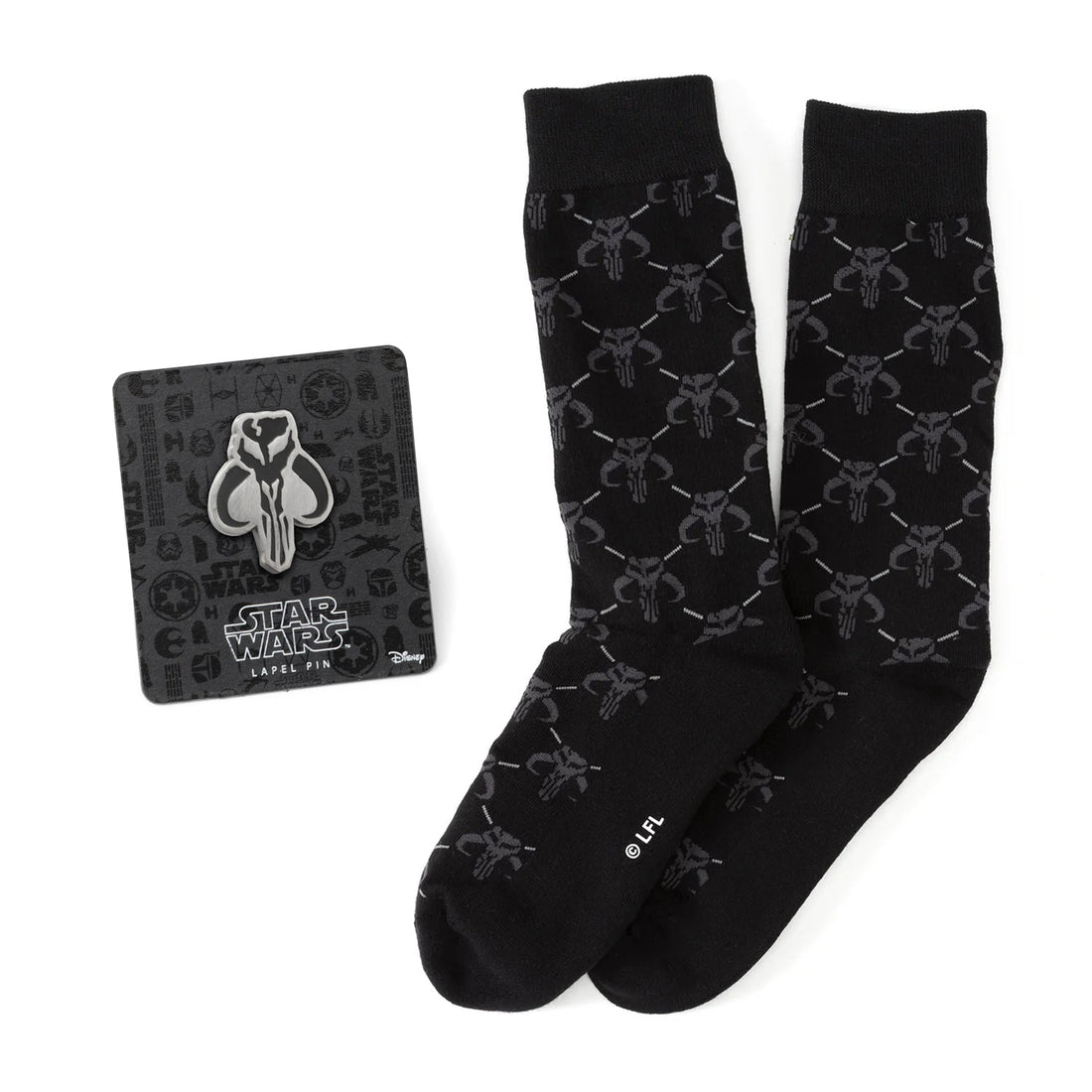 A pair of charcoal gray dress socks with a repeating Mythosaur skull pattern paired with a silver and black Mandalorian Mythosaur lapel pin.