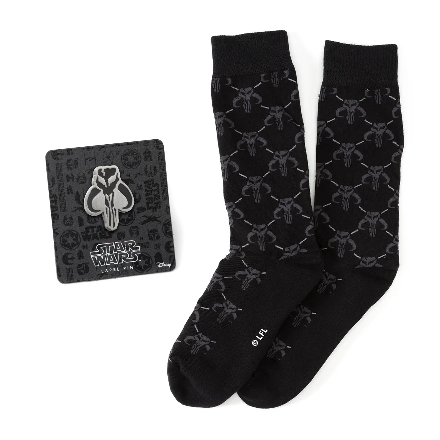 A pair of charcoal gray dress socks with a repeating Mythosaur skull pattern paired with a silver and black Mandalorian Mythosaur lapel pin.