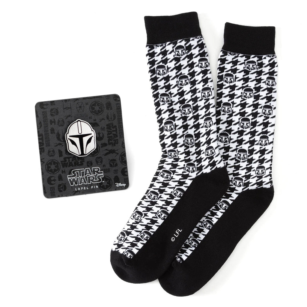 Black and white houndstooth pattern crew socks with Mandalorian helmet icons and a matching Star Wars lapel pin on display.