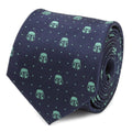Close-up of a navy silk necktie featuring recurring mint green Mandalorian helmet icons and small dot patterns.