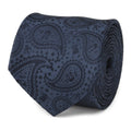 Close up of a navy blue silk necktie featuring a subtle Mandalorian and Grogu paisley pattern.