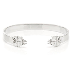 A slim stainless steel cuff bracelet featuring a Millennium Falcon design from Star Wars.
