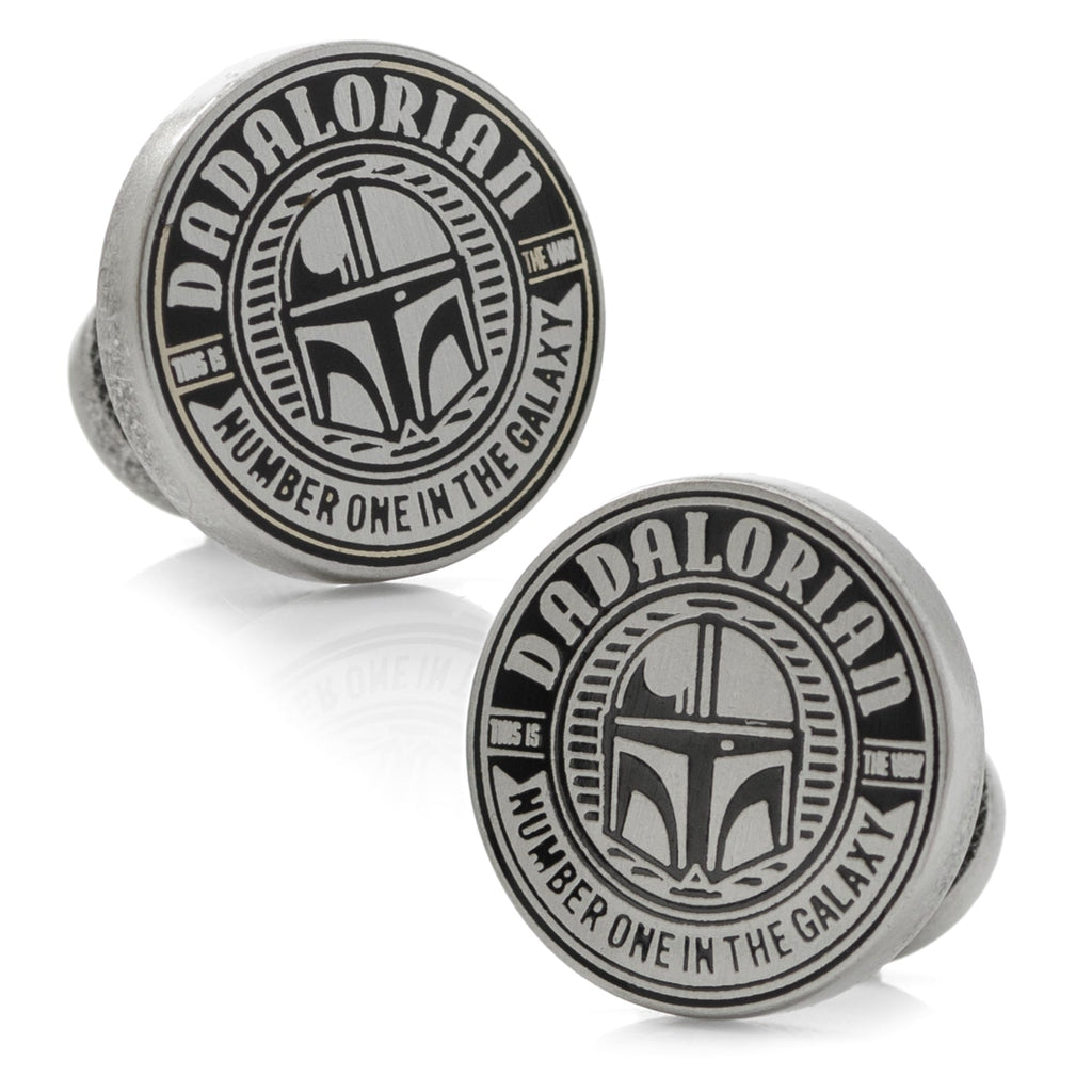 A pair of round Star Wars Dadalorian themed cufflinks featuring a helmet design and text Number One In The Galaxy with a Mythosaur logo on the backing.