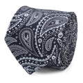 A rolled midnight and sky blue silk tie featuring a paisley pattern with hidden Star Wars Mandalorian symbols.