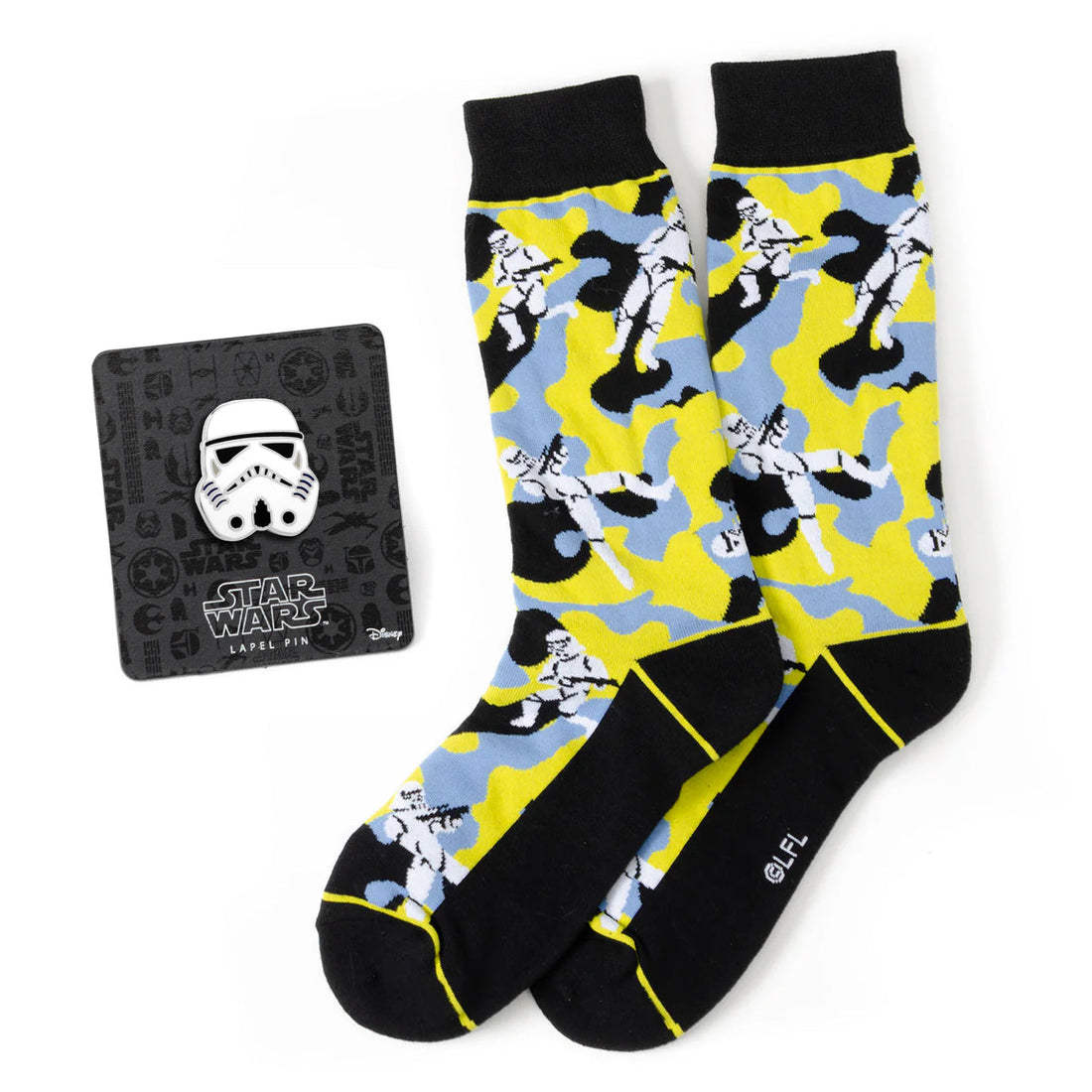 A pair of yellow, blue, and black camo Star Wars Stormtrooper crew socks with a matching white Stormtrooper helmet lapel pin.