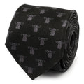 A black silk necktie featuring a repeating print of Grogu (Baby Yoda) from The Mandalorian, shown both rolled up and styled on a mannequin.