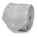 Close up of a cloud grey silk necktie featuring a small repeating pattern of Grogu from The Mandalorian in silver, sage green, and yellow stitching.