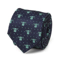 Folded navy blue silk necktie with a repeated pattern of green Grogu characters from The Mandalorian