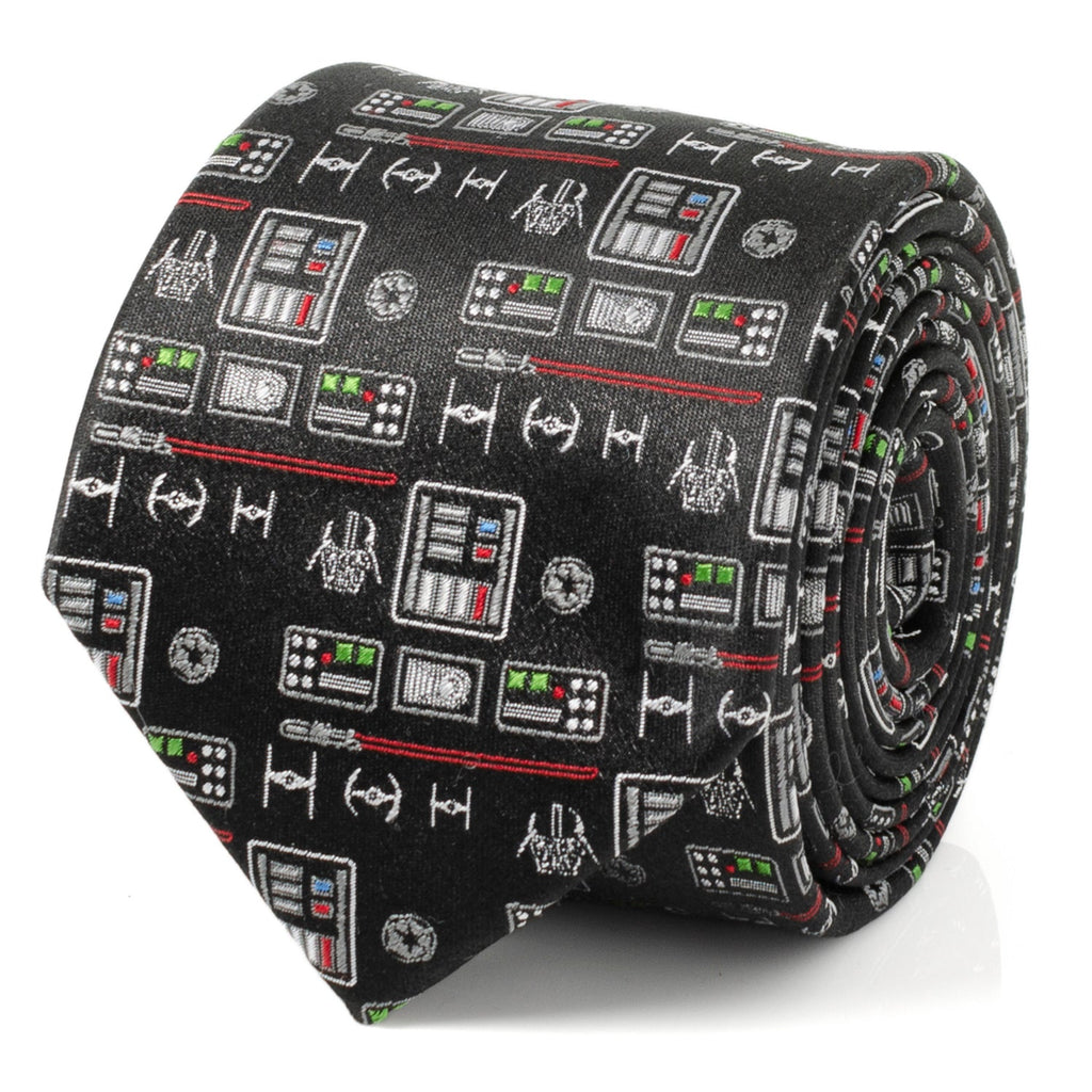 Close-up of a black silk necktie featuring a repeating pattern of Darth Vader chest plates, helmets, and TIE fighter icons.