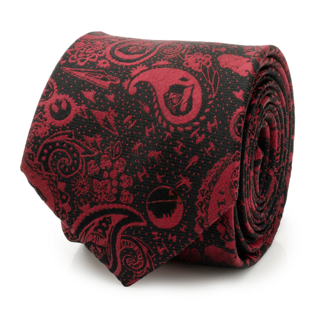 A rolled black and red Star Wars silk tie featuring a paisley pattern with hidden Darth Vader helmets and Imperial icons.