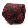 A rolled black and red Star Wars silk tie featuring a paisley pattern with hidden Darth Vader helmets and Imperial icons.