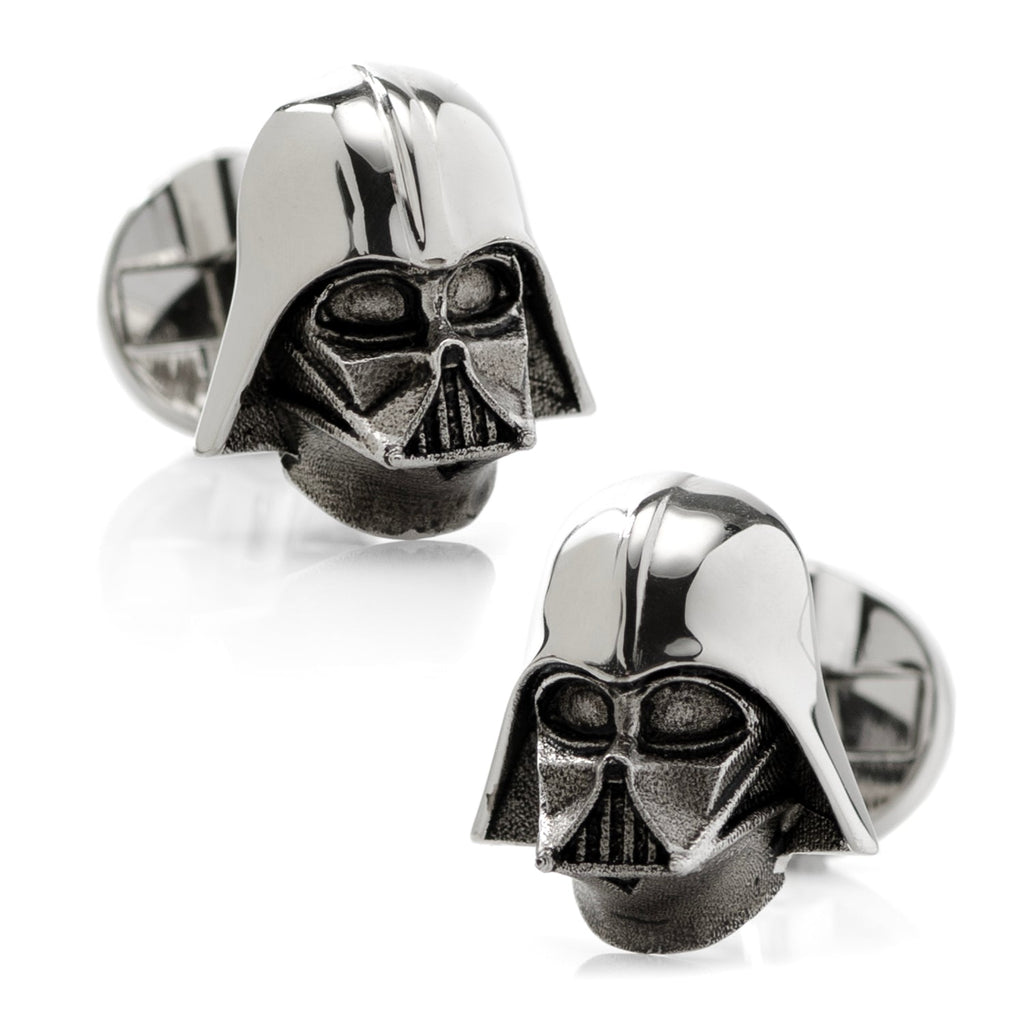 A pair of 3D Darth Vader helmet cufflinks made from polished sterling silver with a swivel backing.