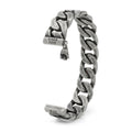Close-up view of an antique silver-tone stainless steel chain link bracelet featuring a Darth Vader helmet charm and Dark Side engraving