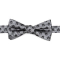 A pre-tied gray bow tie featuring a repeating pattern of Darth Vader helmets and white polka dots on a white dress shirt background.