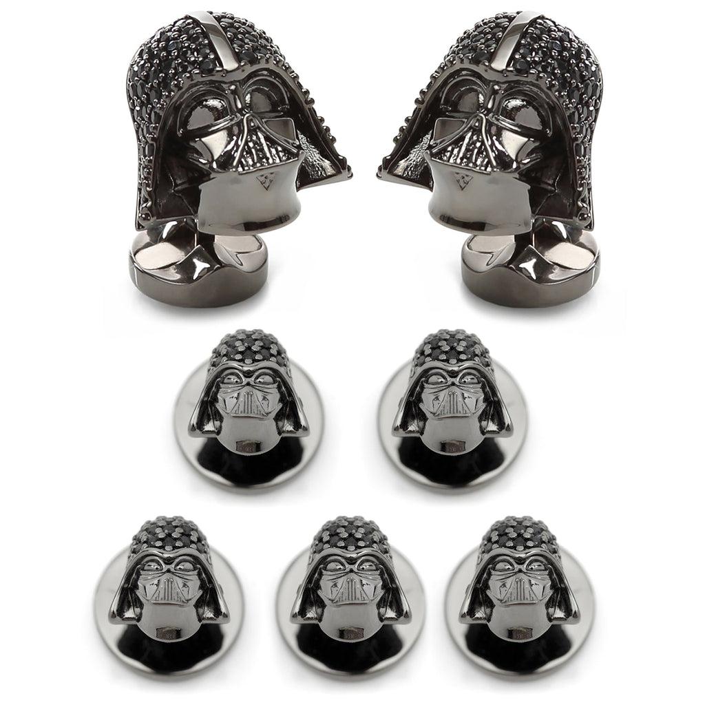A close-up view of Star Wars Darth Vader helmet cufflinks and shirt studs featuring black pavé crystals and gunmetal plating.