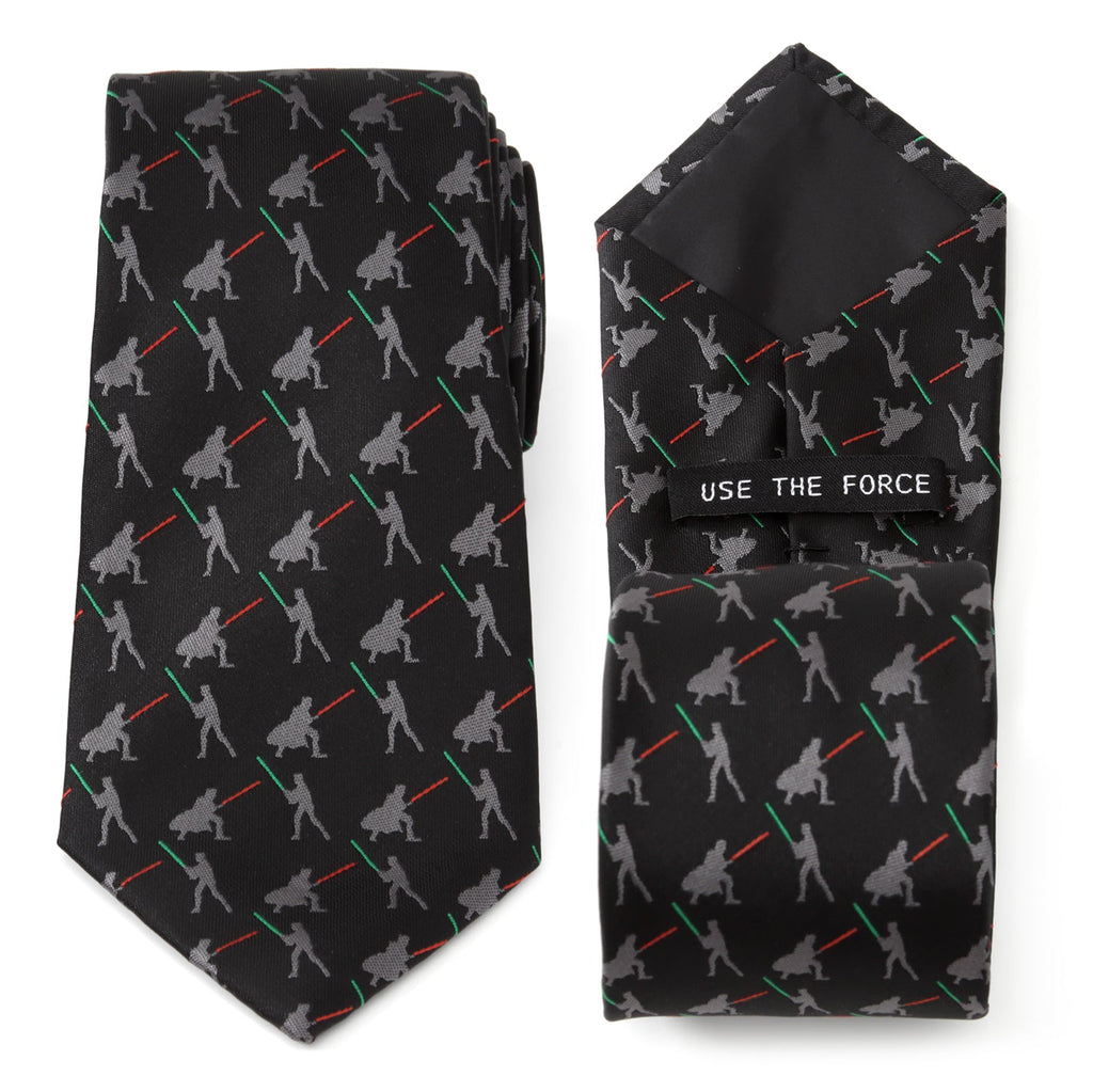 Close up of a black Star Wars tie showing a repeating pattern of Darth Vader and Luke Skywalker dueling with red and green lightsabers