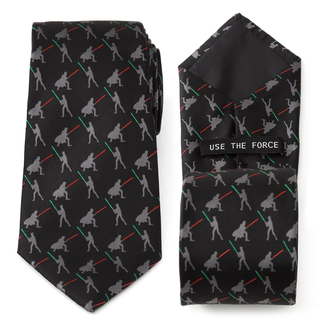 Close up of a black Star Wars tie showing a repeating pattern of Darth Vader and Luke Skywalker dueling with red and green lightsabers