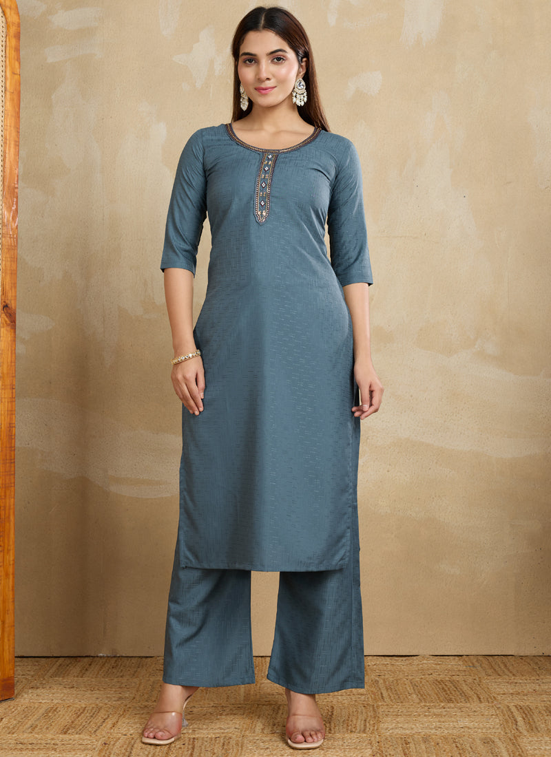 Model wearing a stylish grey printed cotton blend kurta with matching printed pants