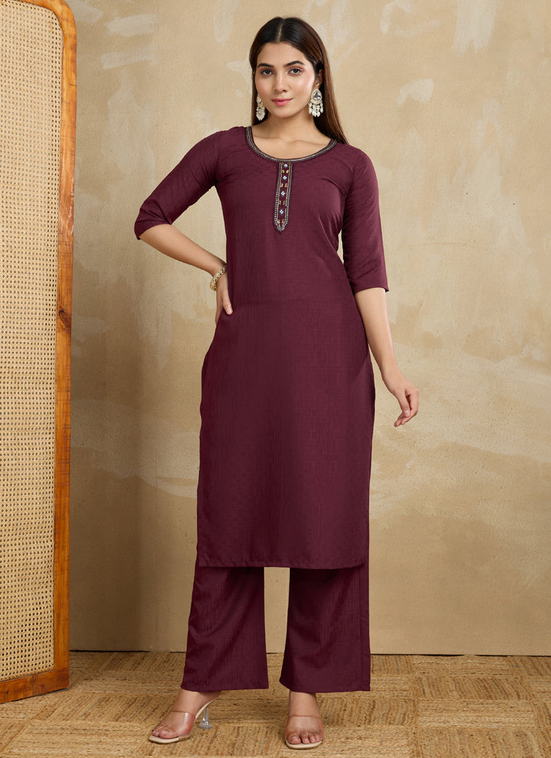 A stylish maroon printed cotton blend kurta paired with matching printed pants