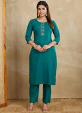 Woman wearing a Rama printed cotton blend kurta and matching pant set for a stylish ethnic look.