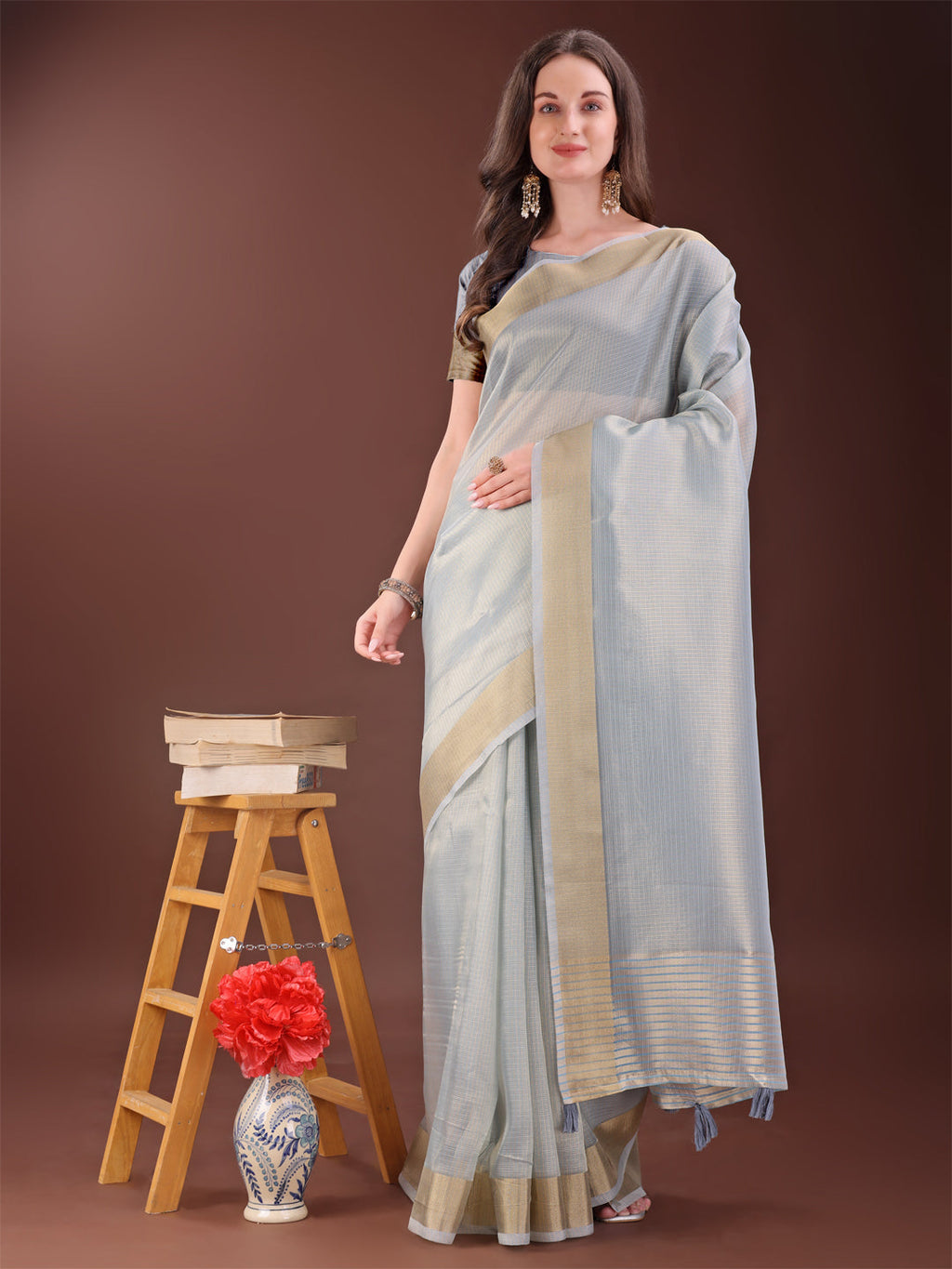 Elegant Grey organza saree with a shimmering golden zari border