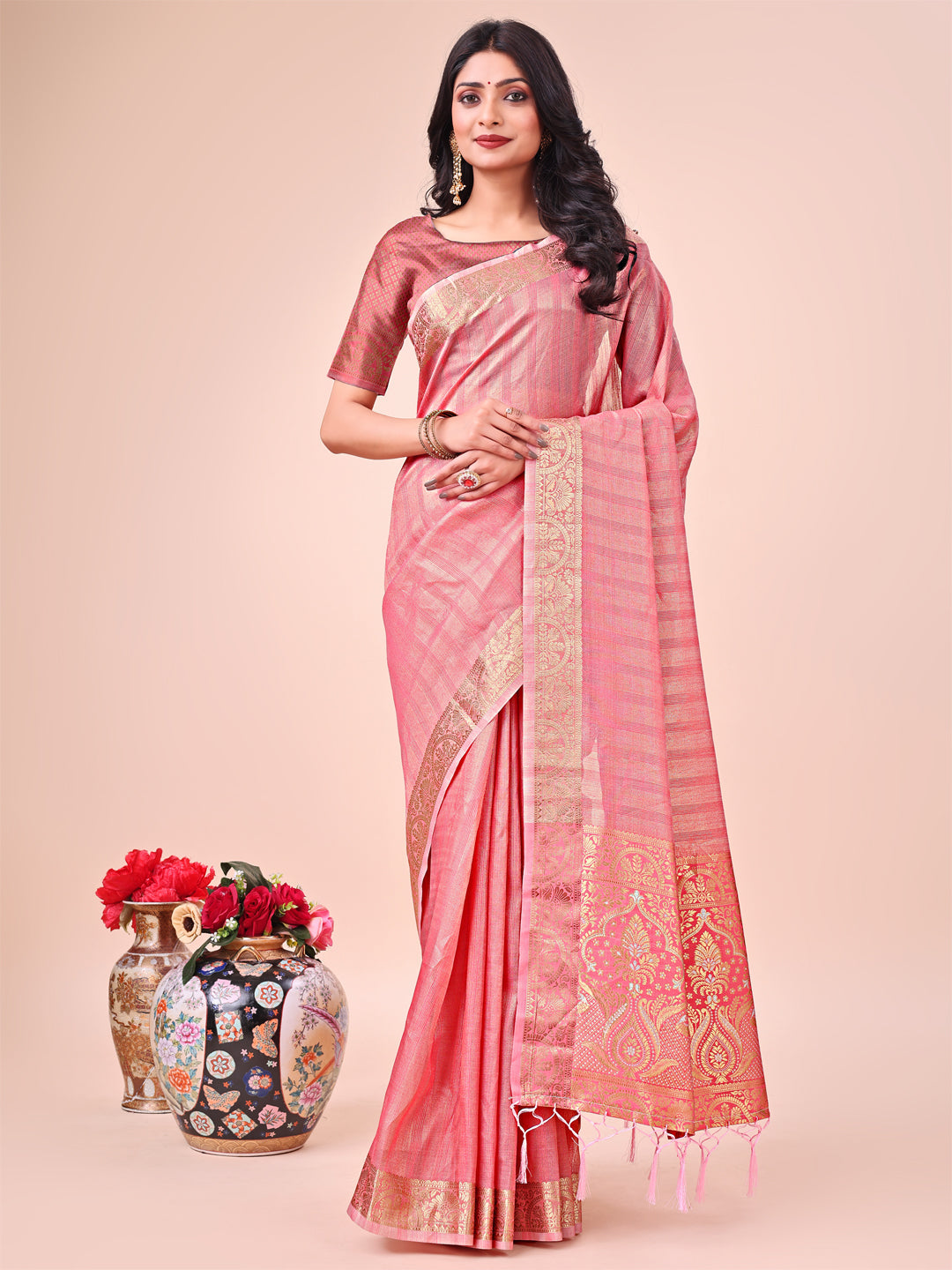 Light Peach organza saree with delicate zari border and traditional motifs