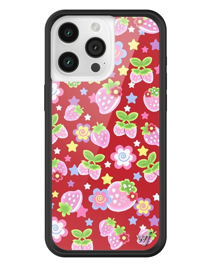 iPhone case featuring a red background with a strawberry, star, and flower pattern and a black rubber bumper.