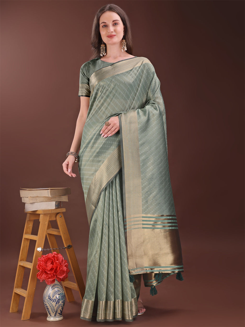 Green organza saree with golden zari border and pallu detail