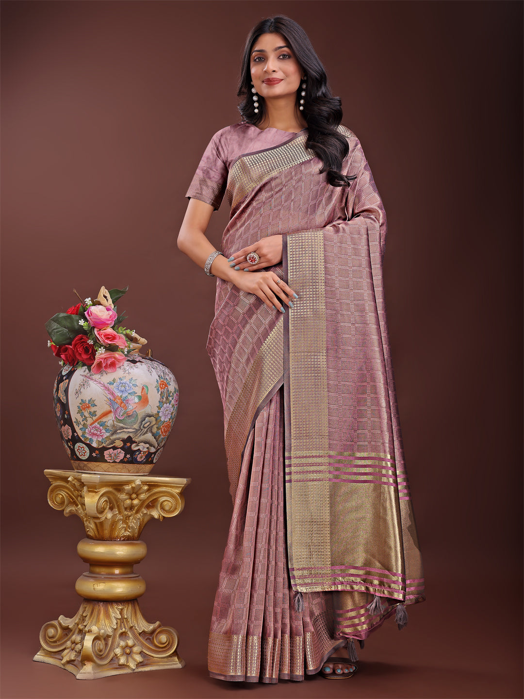 Magenta organza saree with golden zari border and matching blouse