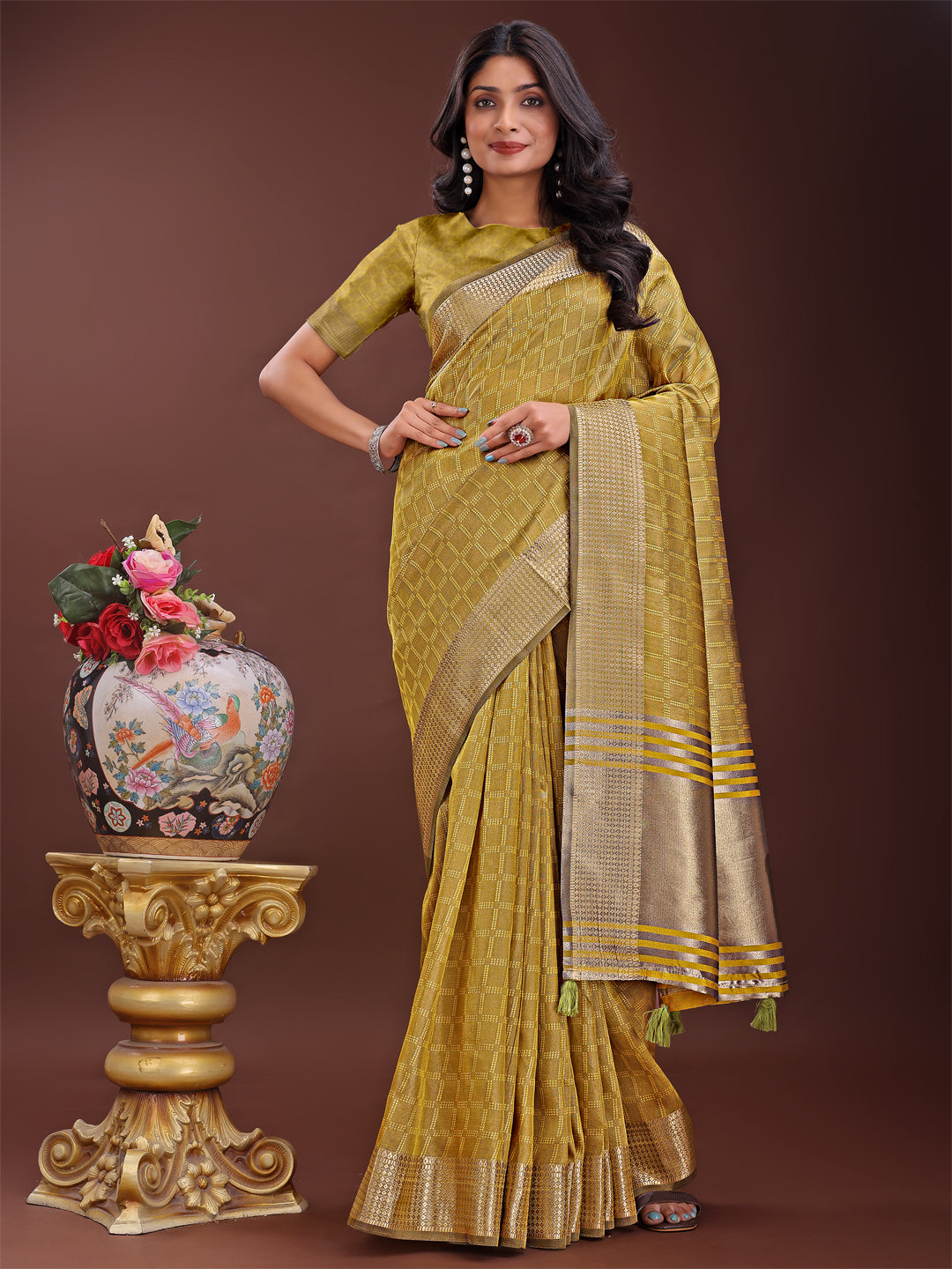 Mustard yellow organza saree with intricate golden zari border