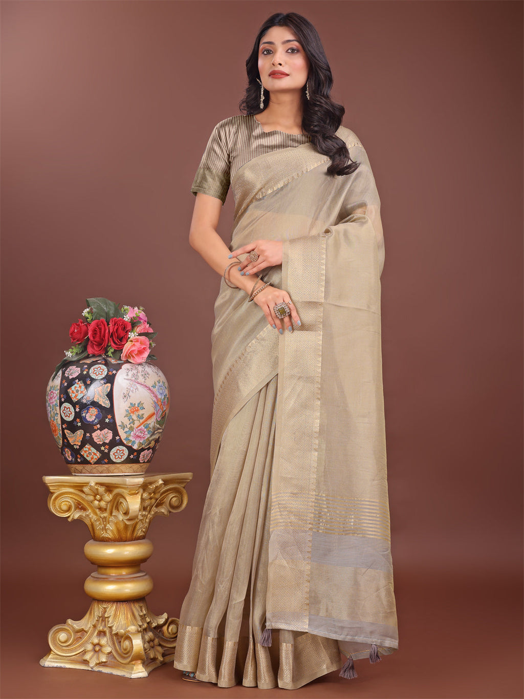 Beige linen saree with golden zari border and elegant pallu