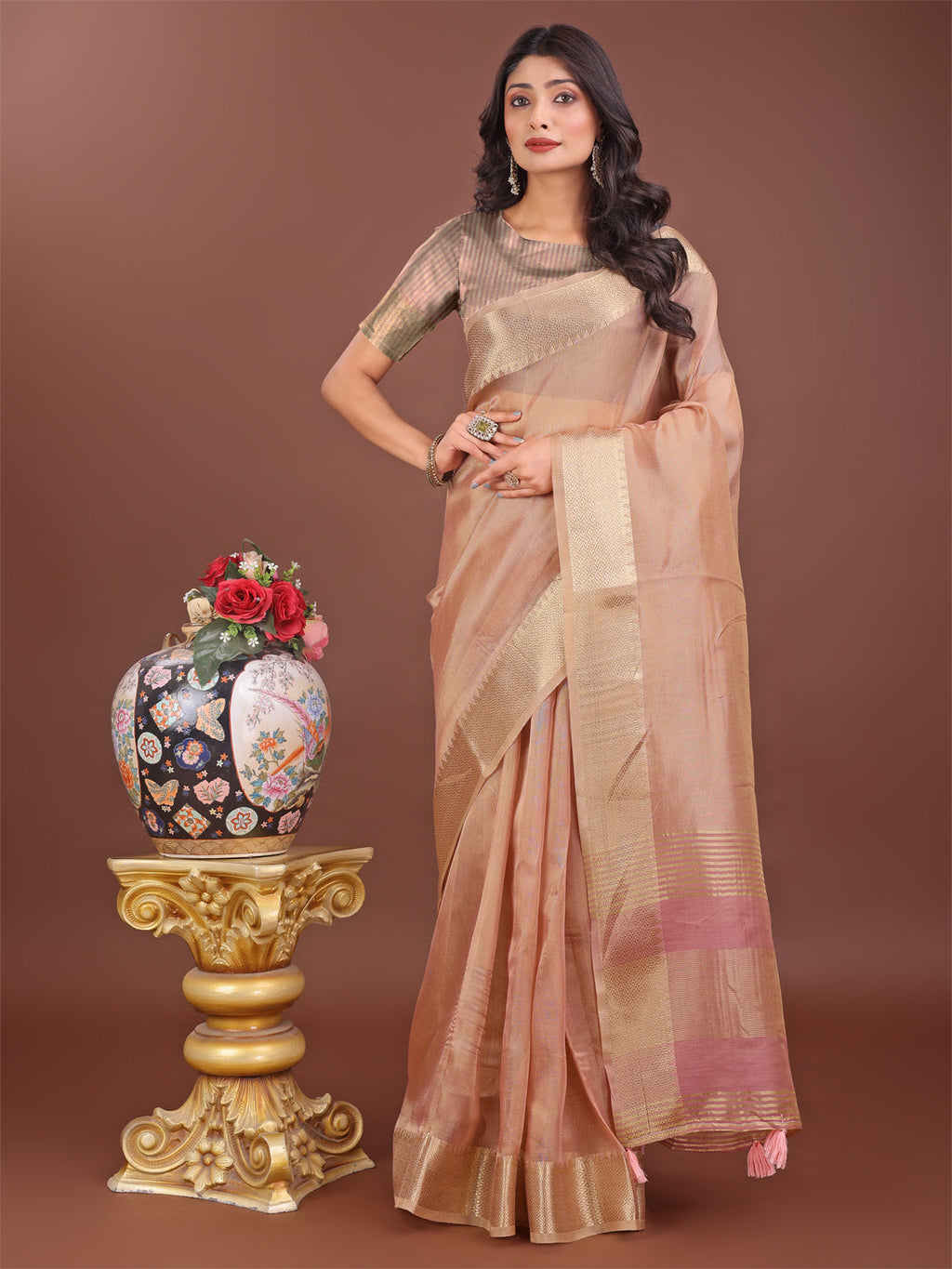 Peach linen saree with golden zari border and elegant rich pallu