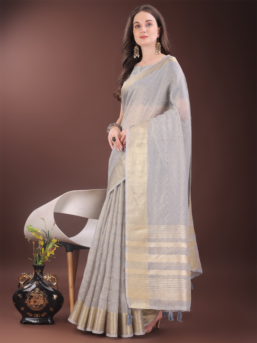 Elegant Grey Organza Saree with Golden Zari Border and Tassels