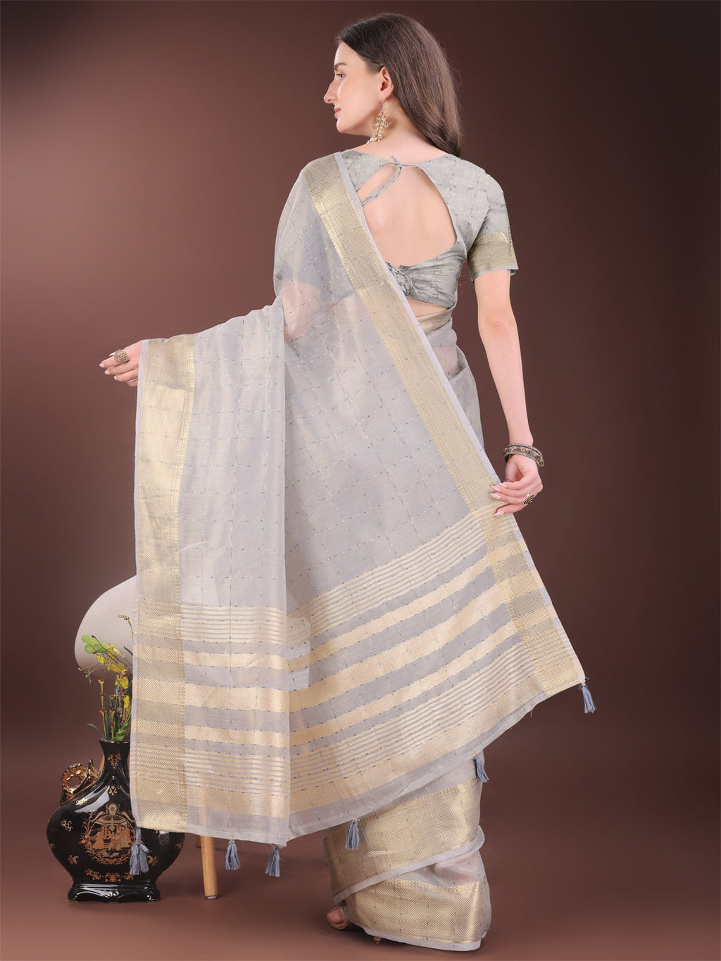Elegant Grey Organza Saree with Golden Zari Border and Tassels