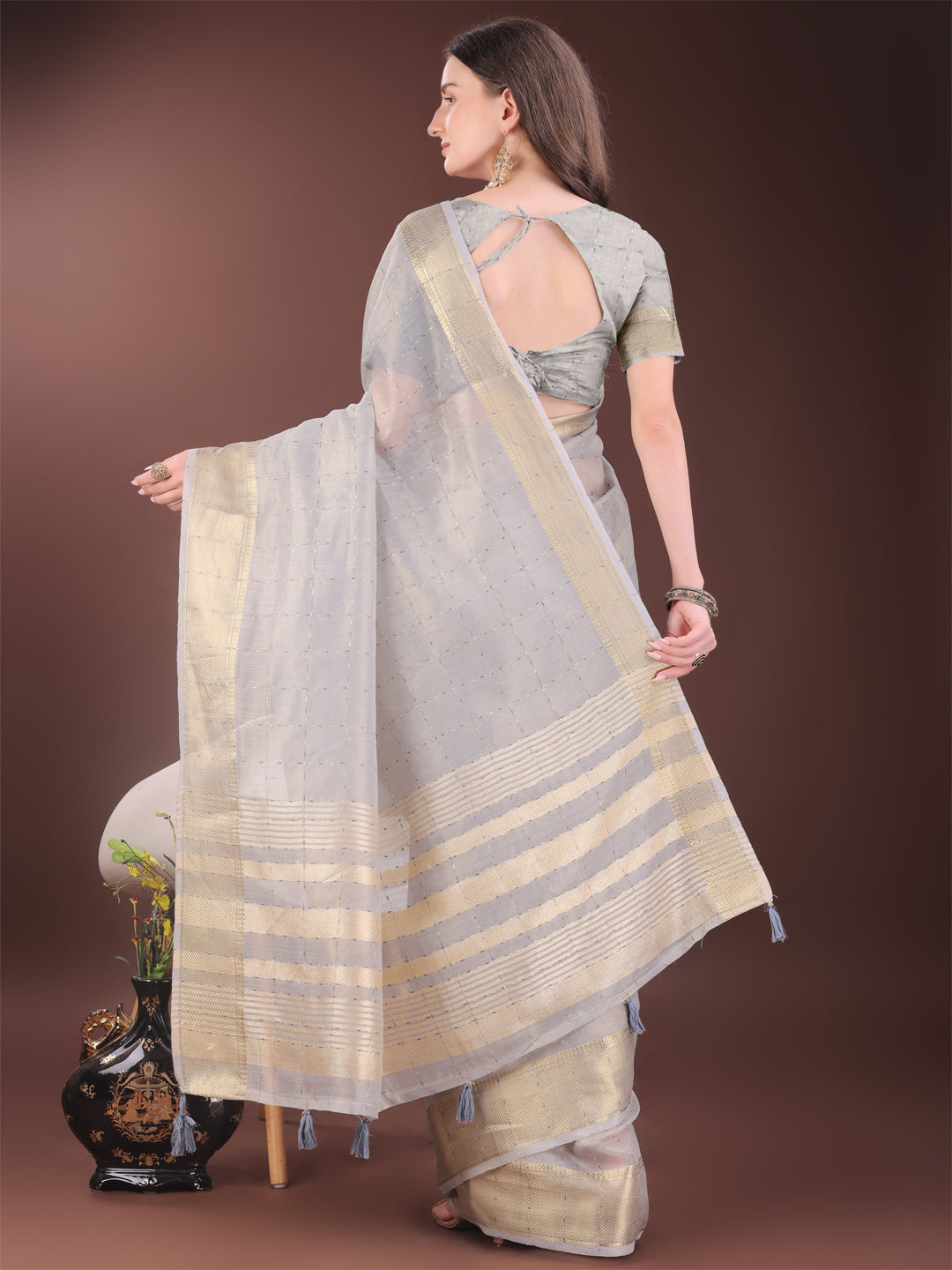 Elegant Grey Organza Saree with Golden Zari Border and Tassels