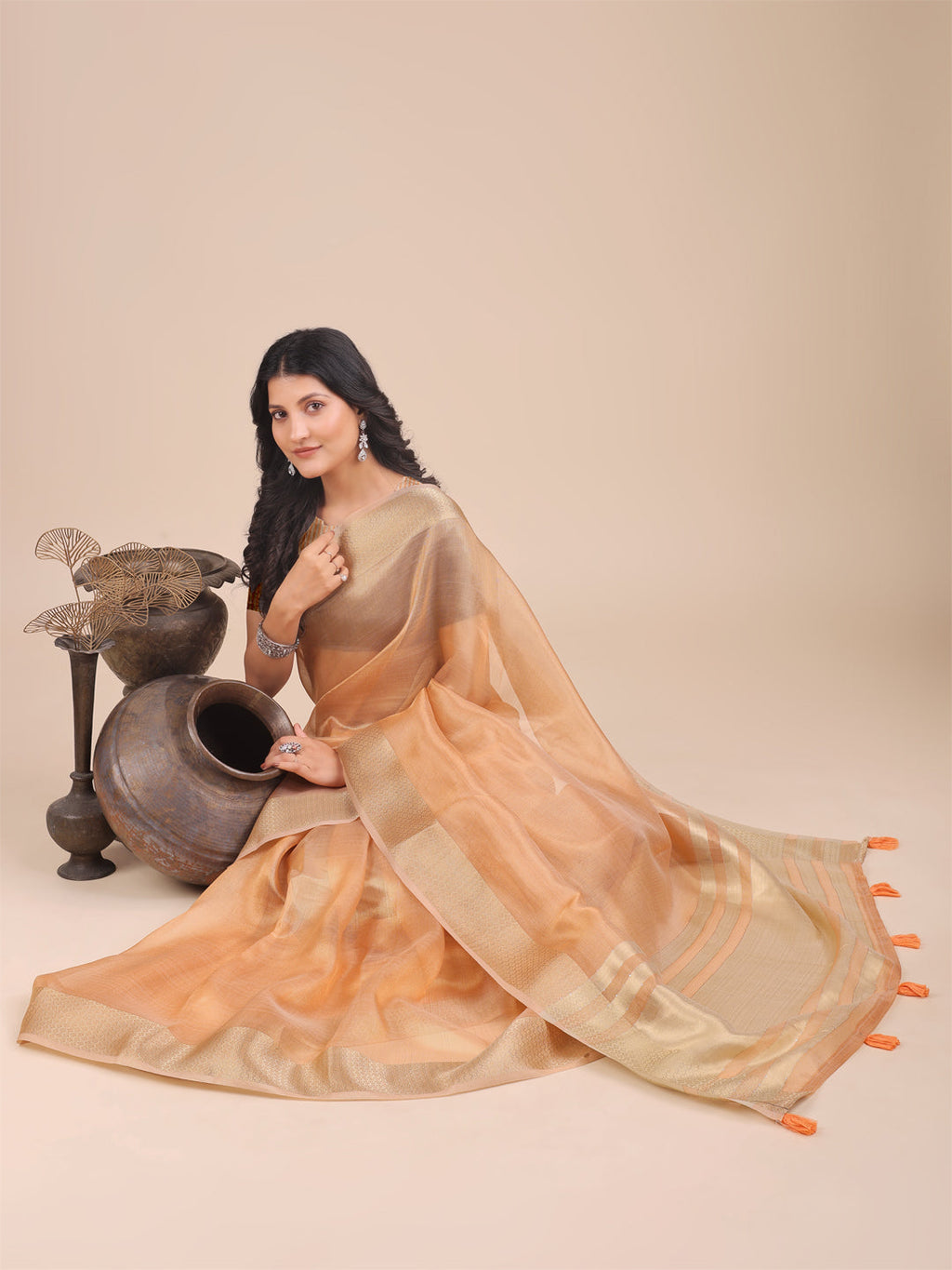 Orange Organza Saree with Woven Zari Work and Traditional Tassels