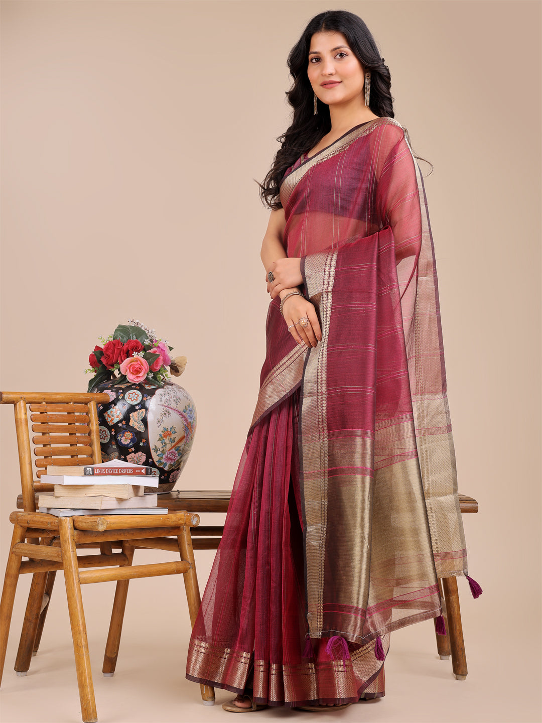 Magenta Organza Saree with Woven Zari Work and Traditional Tassels