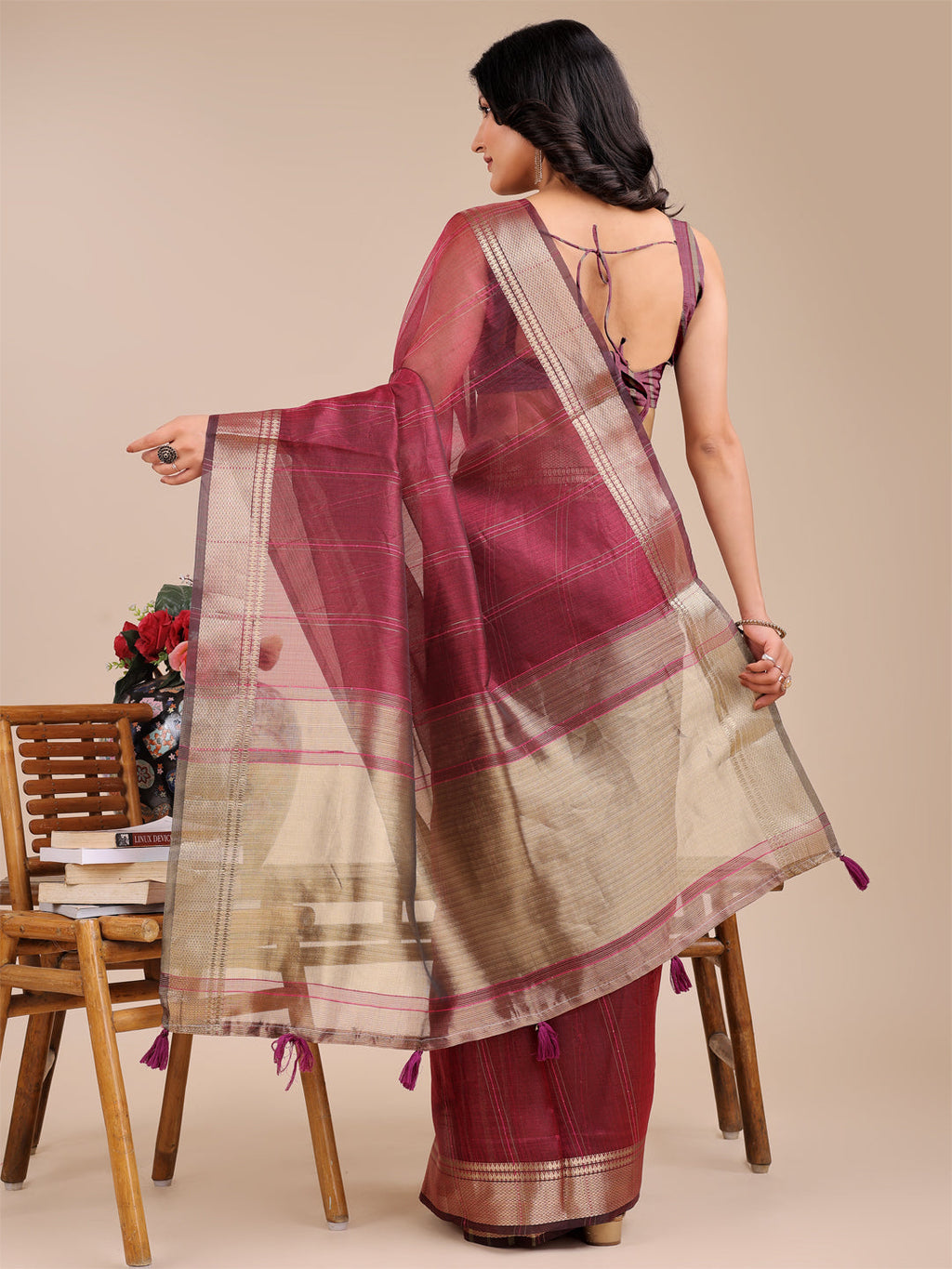 Magenta Organza Saree with Woven Zari Work and Traditional Tassels