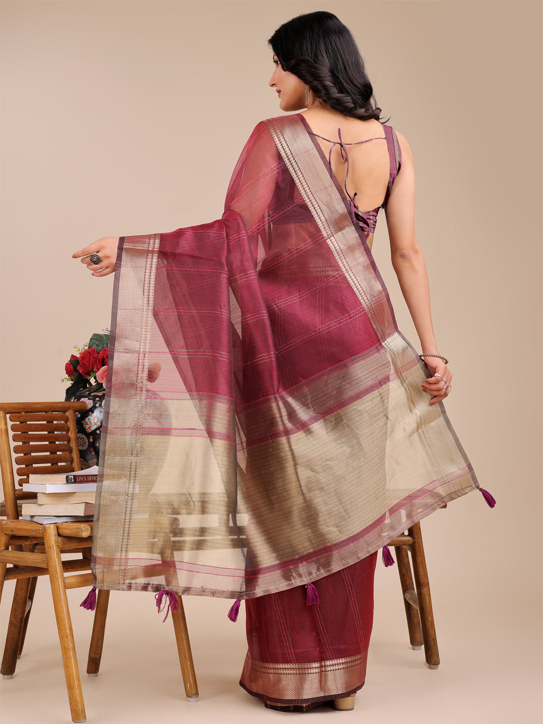 Magenta Organza Saree with Woven Zari Work and Traditional Tassels