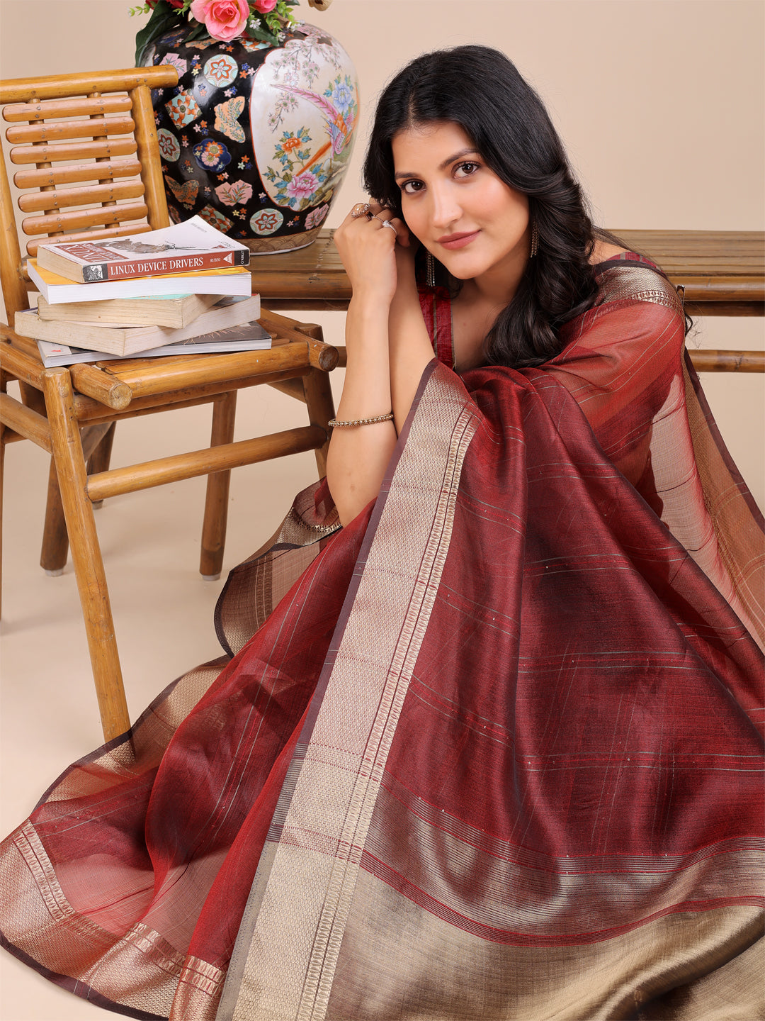 Maroon Organza Saree with Woven Zari Work and Tassel Details