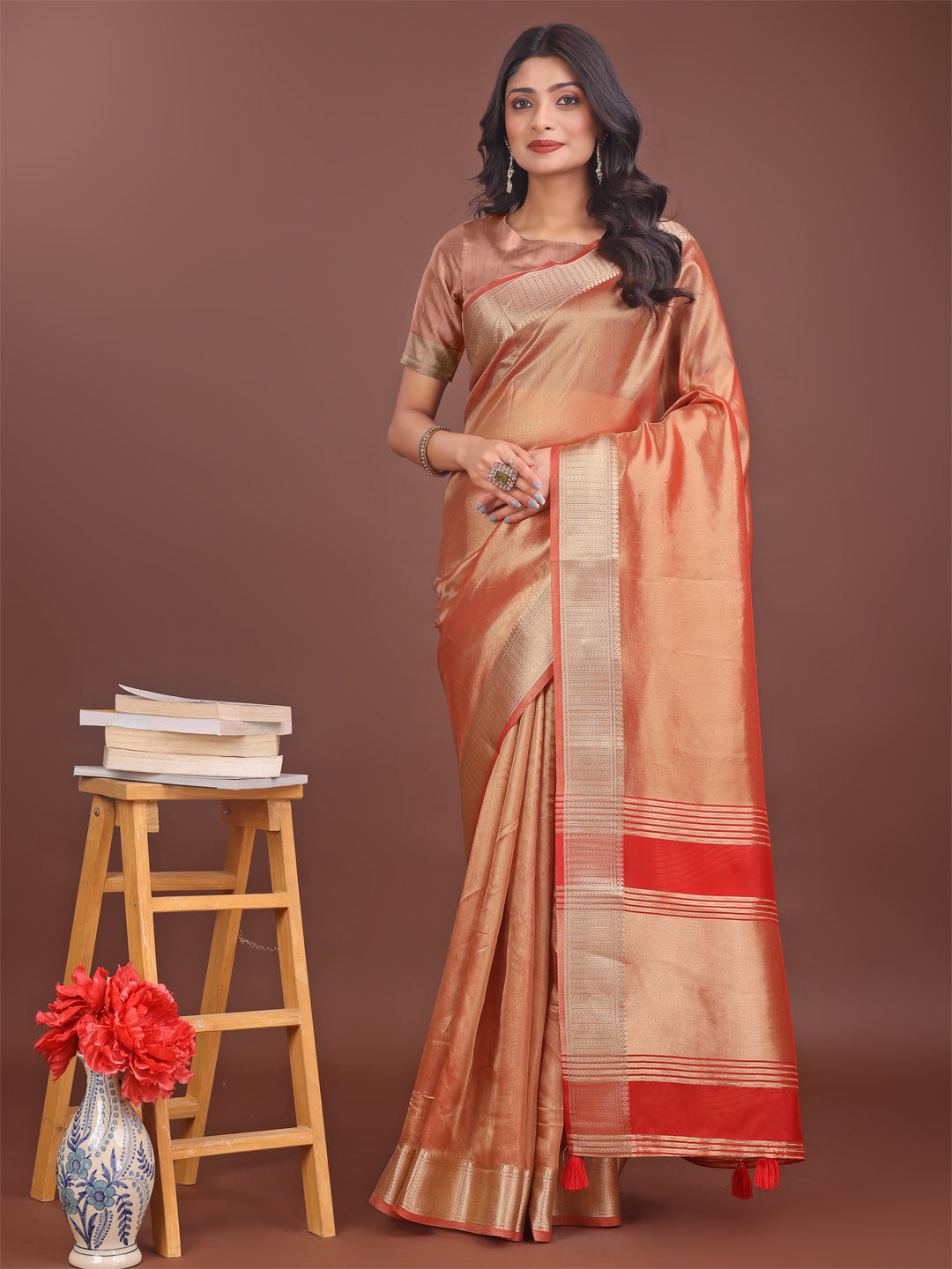 Dual-shade orange and red organza saree with rich gold zari border