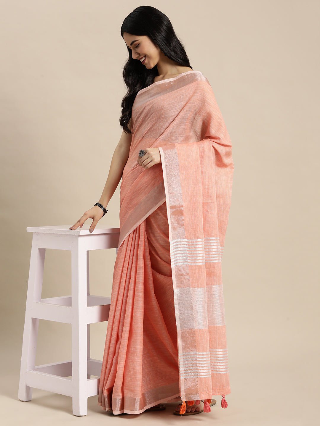 Peach Linen Saree with Contrast Zari Border and Tassels