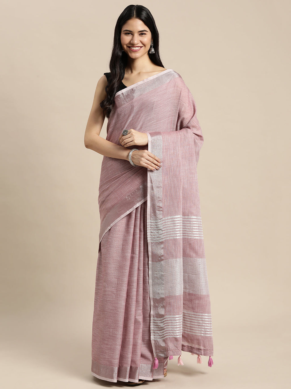 Elegant mauve woven linen saree with metallic zari border and tassels