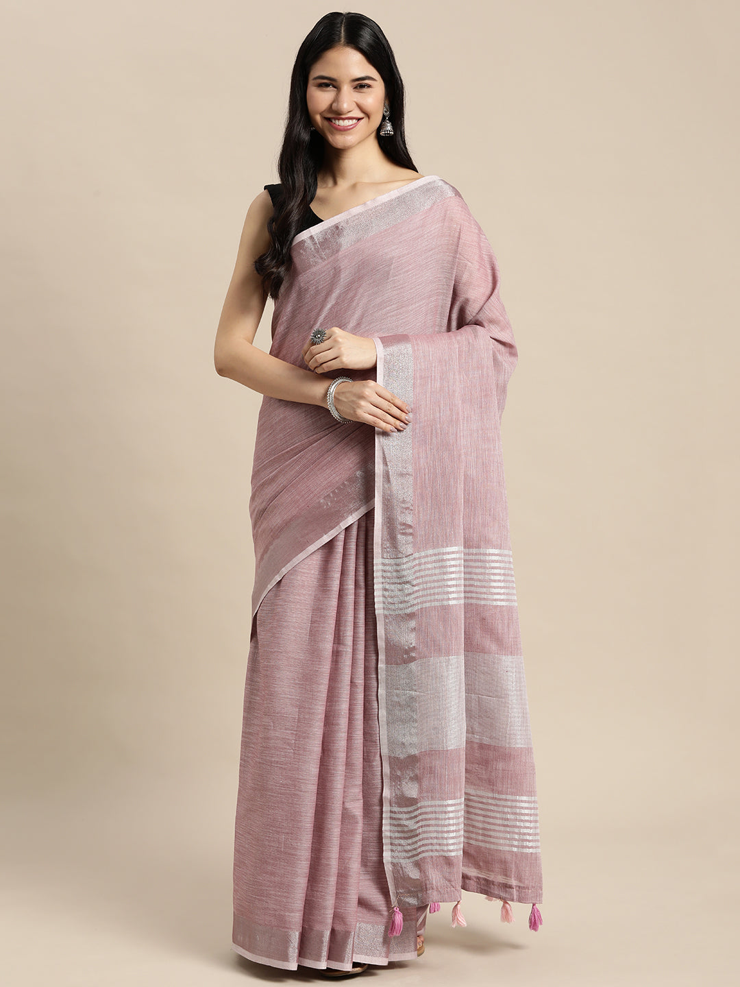 Elegant mauve woven linen saree with metallic zari border and tassels