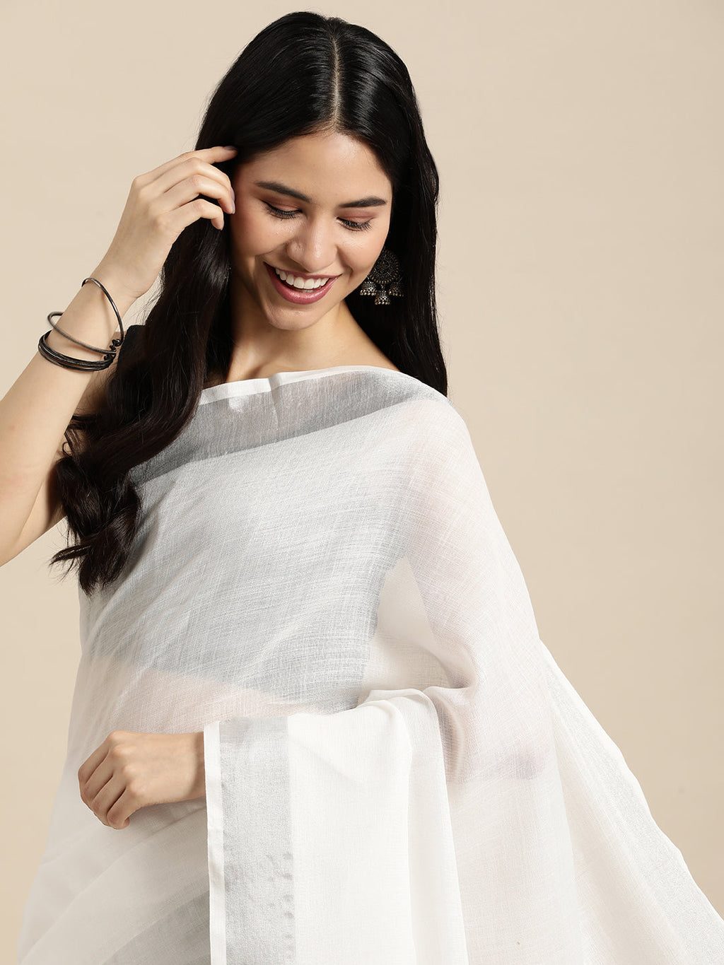 Elegant White Woven Linen Saree with Contrast Zari Border and Tassels
